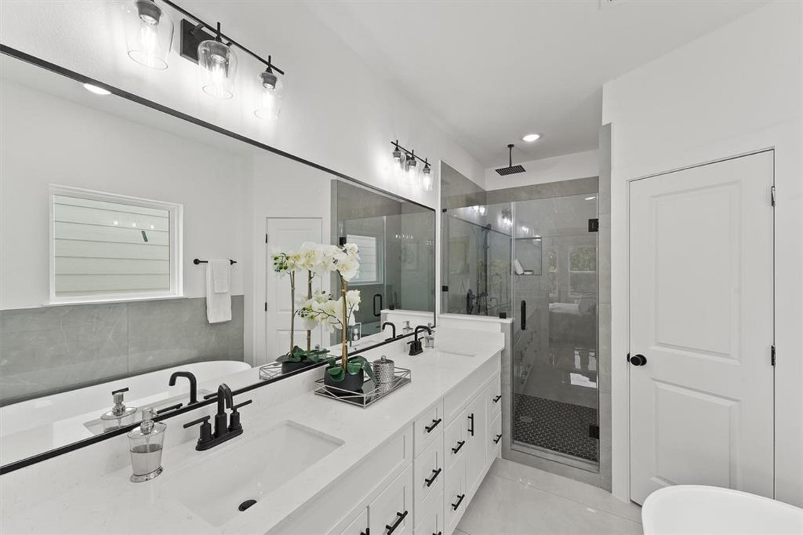 1207 Cavalcade Street, Unit B Houston, TX 77009 - Photo 16 of 20 a bathroom with a sink double vanity and a shower