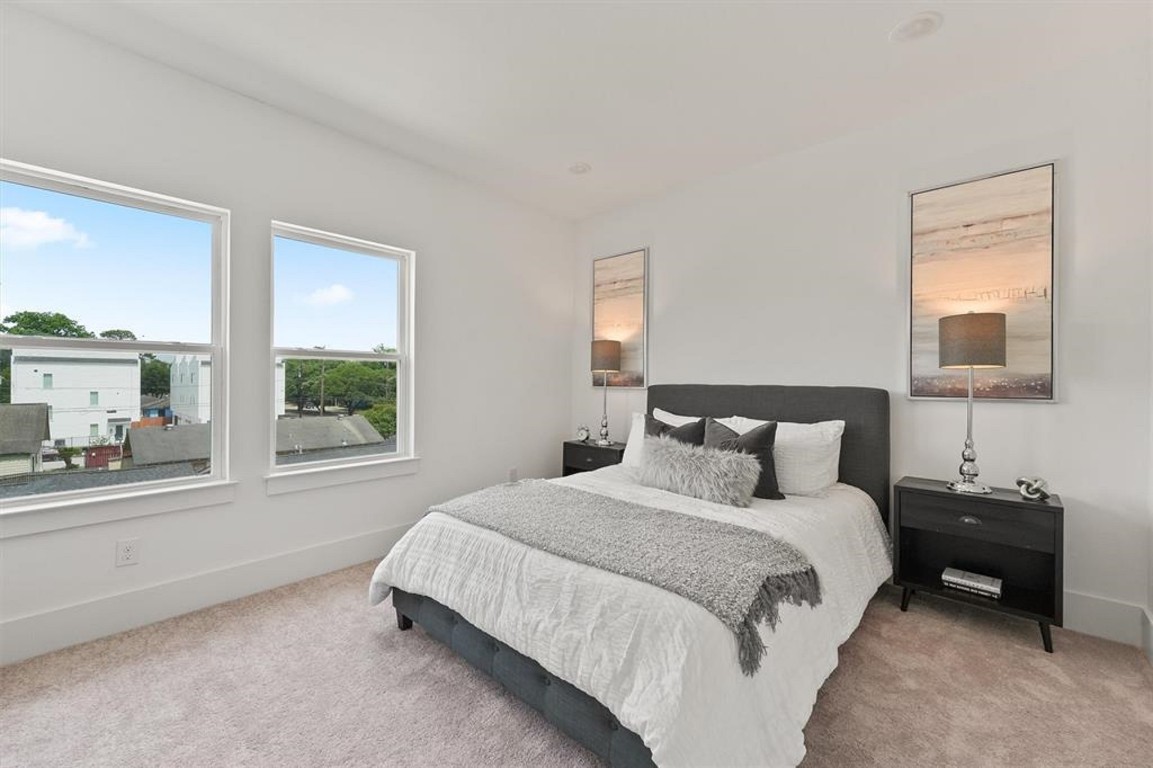 1207 Cavalcade Street, Unit B Houston, TX 77009 - Photo 19 of 20 a bedroom with a bed and a window