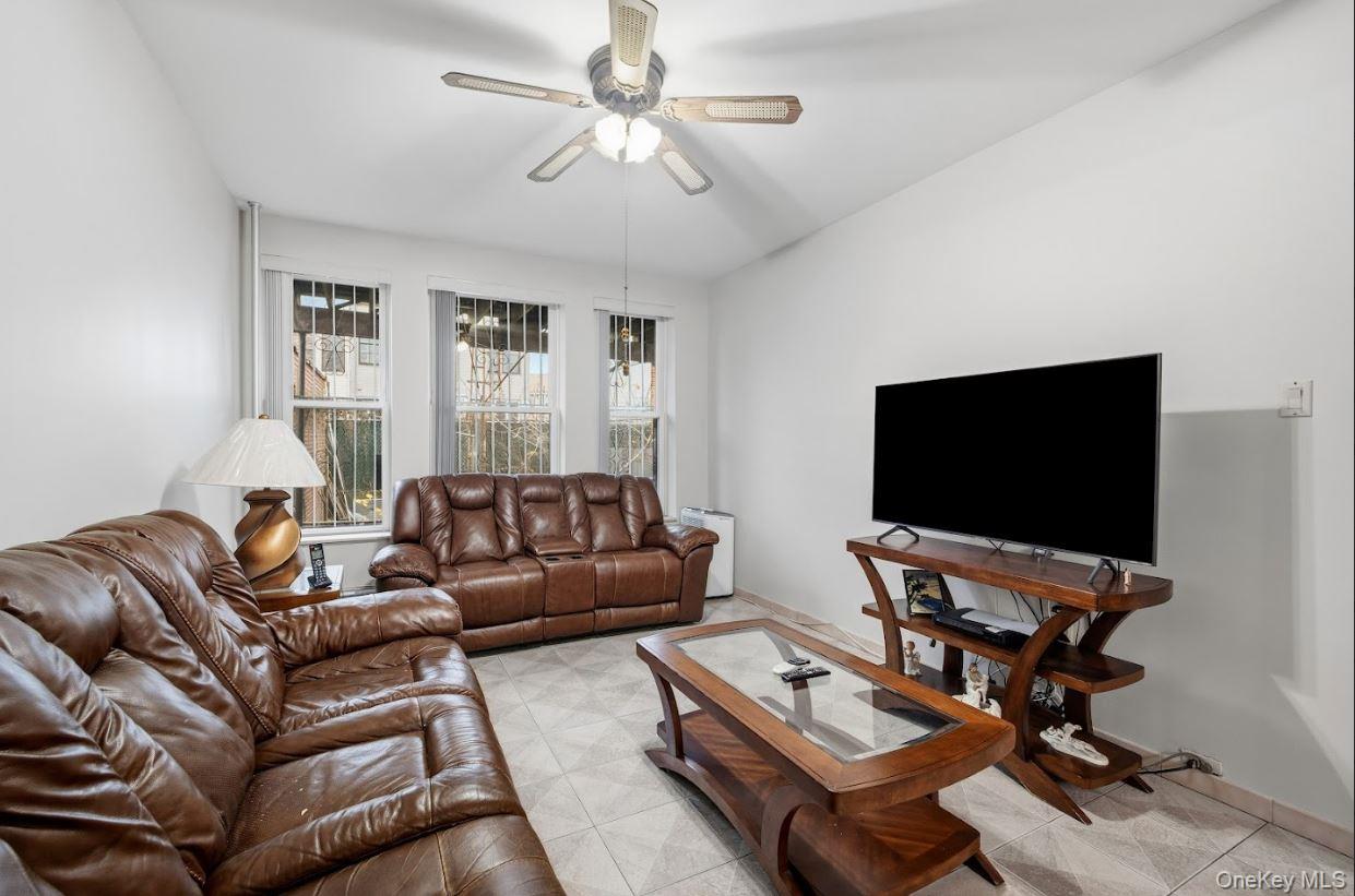 20-15 Menahan Street Queens, NY 11385 - Photo 13 of 41 a living room with furniture and a flat screen tv
