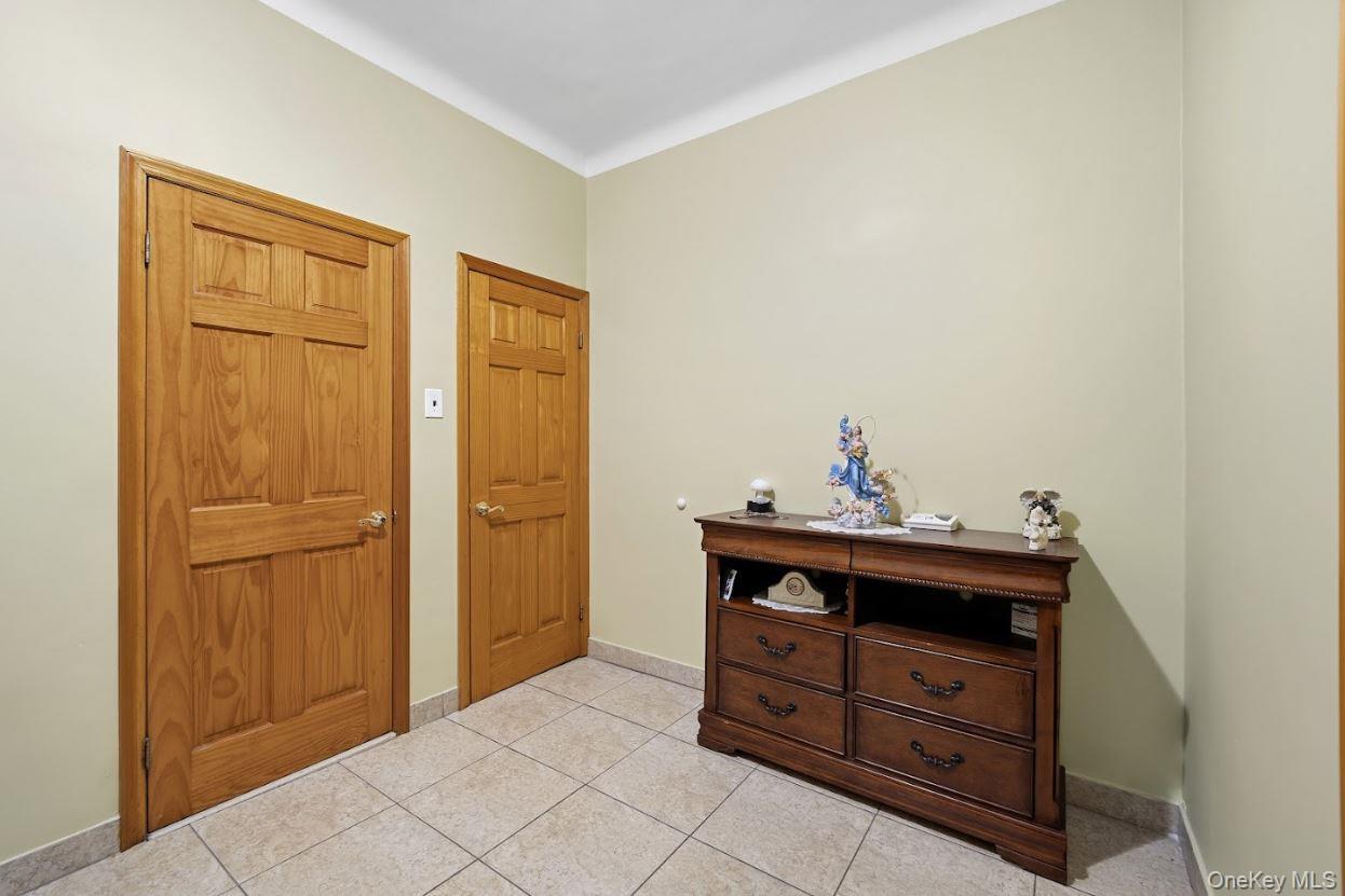 20-15 Menahan Street Queens, NY 11385 - Photo 17 of 41 a bed room with a bed and a dresser