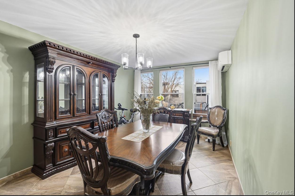20-15 Menahan Street Queens, NY 11385 - Photo 22 of 41 a view of a dining room with furniture and chandelier