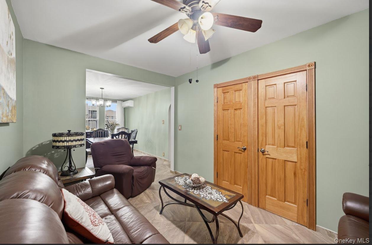 20-15 Menahan Street Queens, NY 11385 - Photo 25 of 41 a living room with furniture and a wooden floor