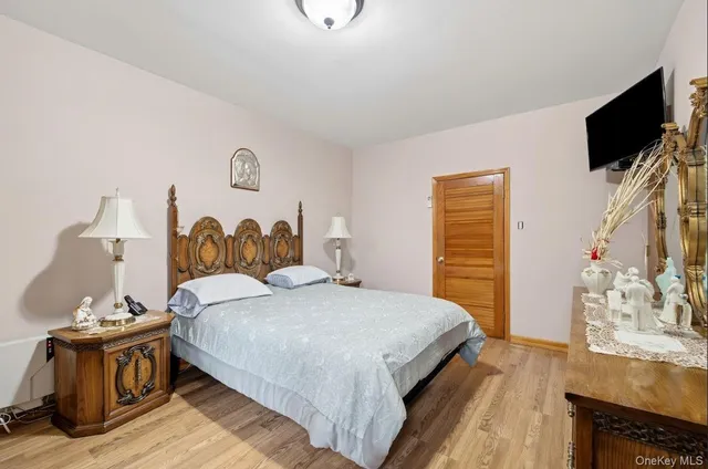 a large white bed in a white room