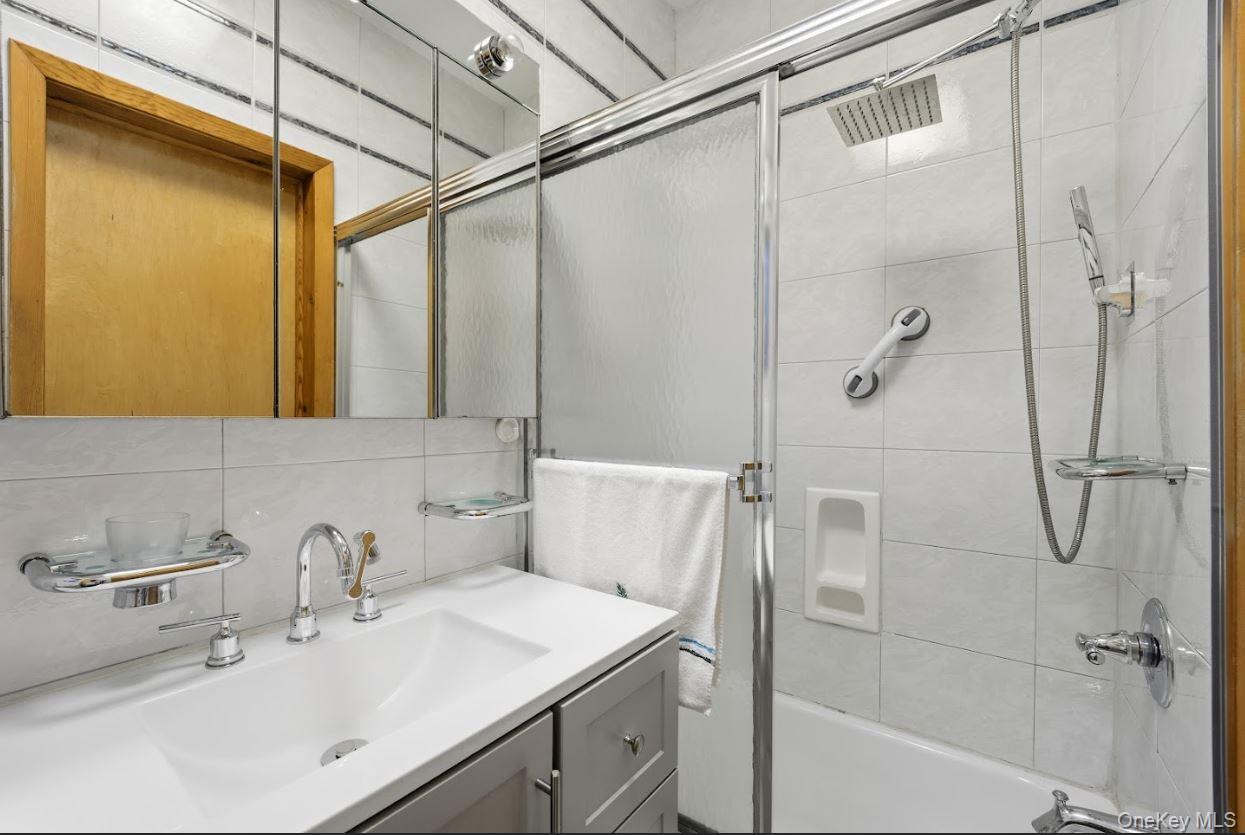 20-15 Menahan Street Queens, NY 11385 - Photo 30 of 41 a bathroom with a sink and shower