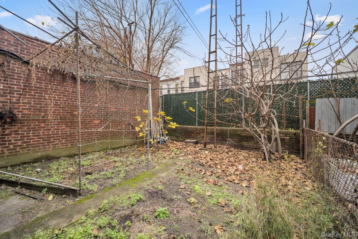 20-15 Menahan Street Queens, NY 11385 - Photo 33 of 41 a view of a backyard of the house