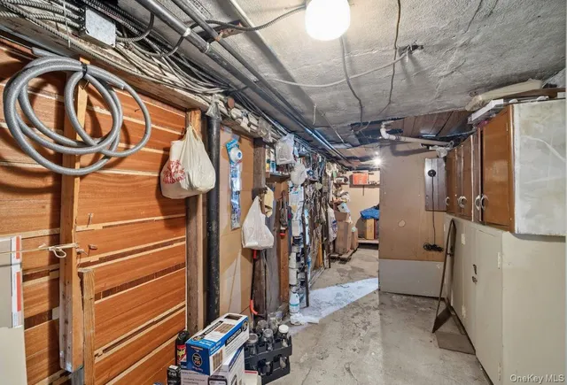 a living room with lots of furniture and clutter