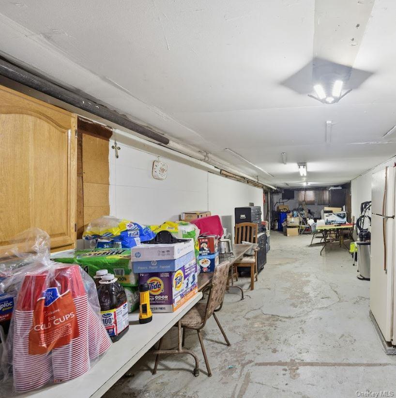 20-15 Menahan Street Queens, NY 11385 - Photo 36 of 41 a living room with lots of furniture and clutter