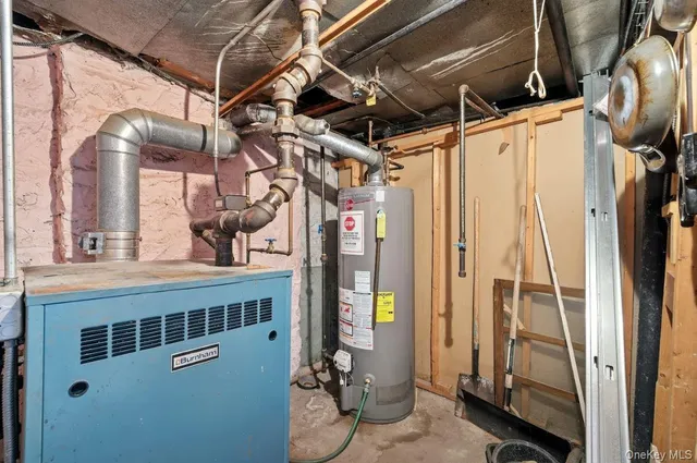 a kitchen with a stove a refrigerator and cabinets