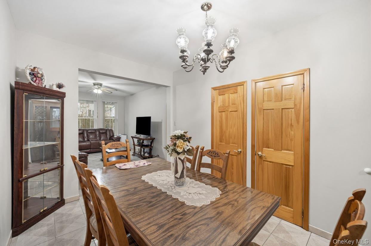 20-15 Menahan Street Queens, NY 11385 - Photo 10 of 41 a view of a dining room with furniture and wooden floor