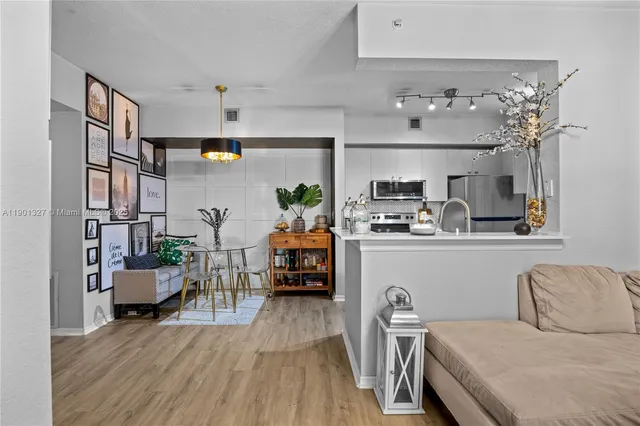 a living room with furniture and flat screen tv