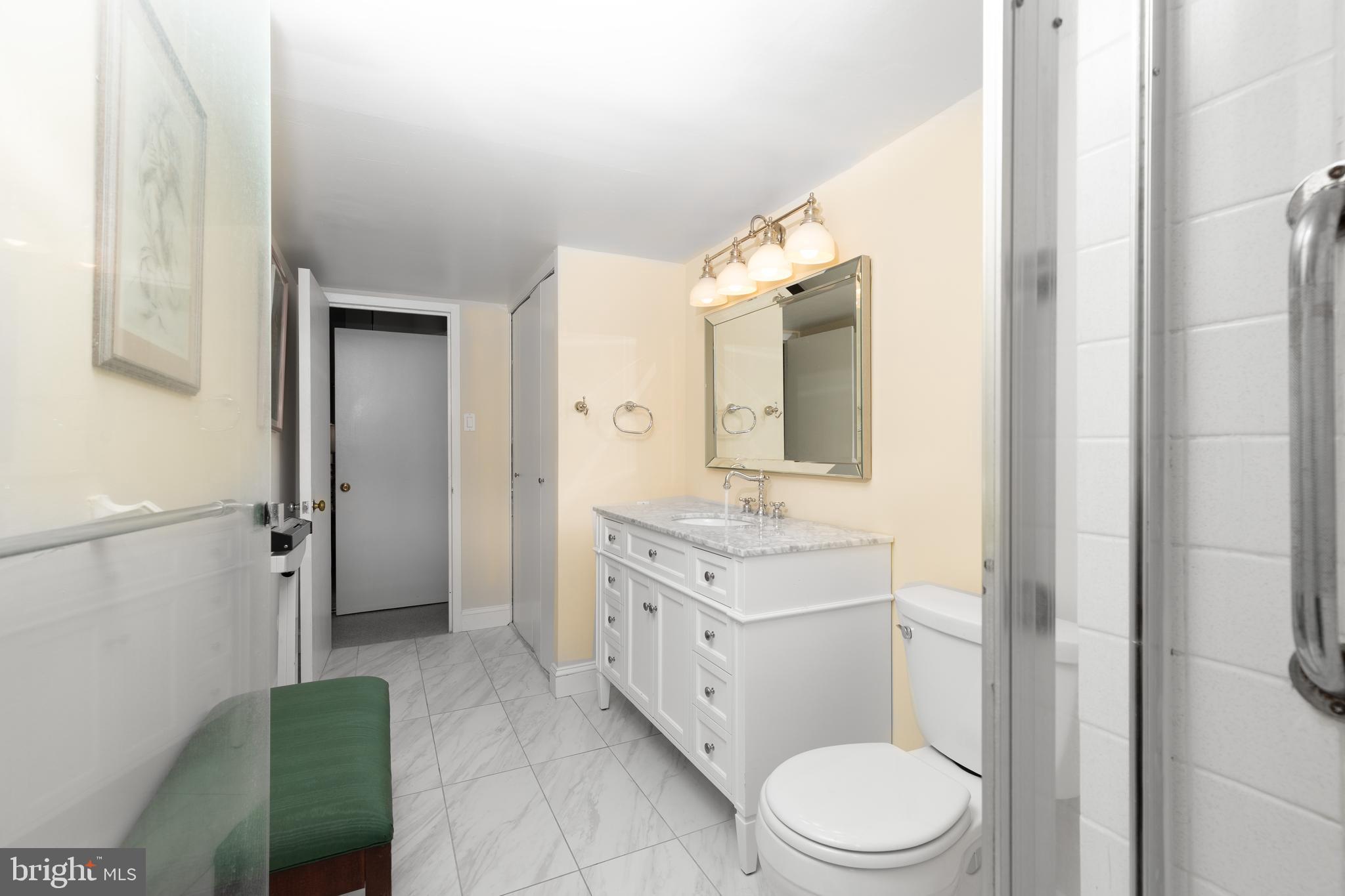 20 Conshohocken State Road, Unit 611 Bala Cynwyd, PA 19004 - Photo 11 of 25 a spacious bathroom with a granite countertop toilet sink and mirror