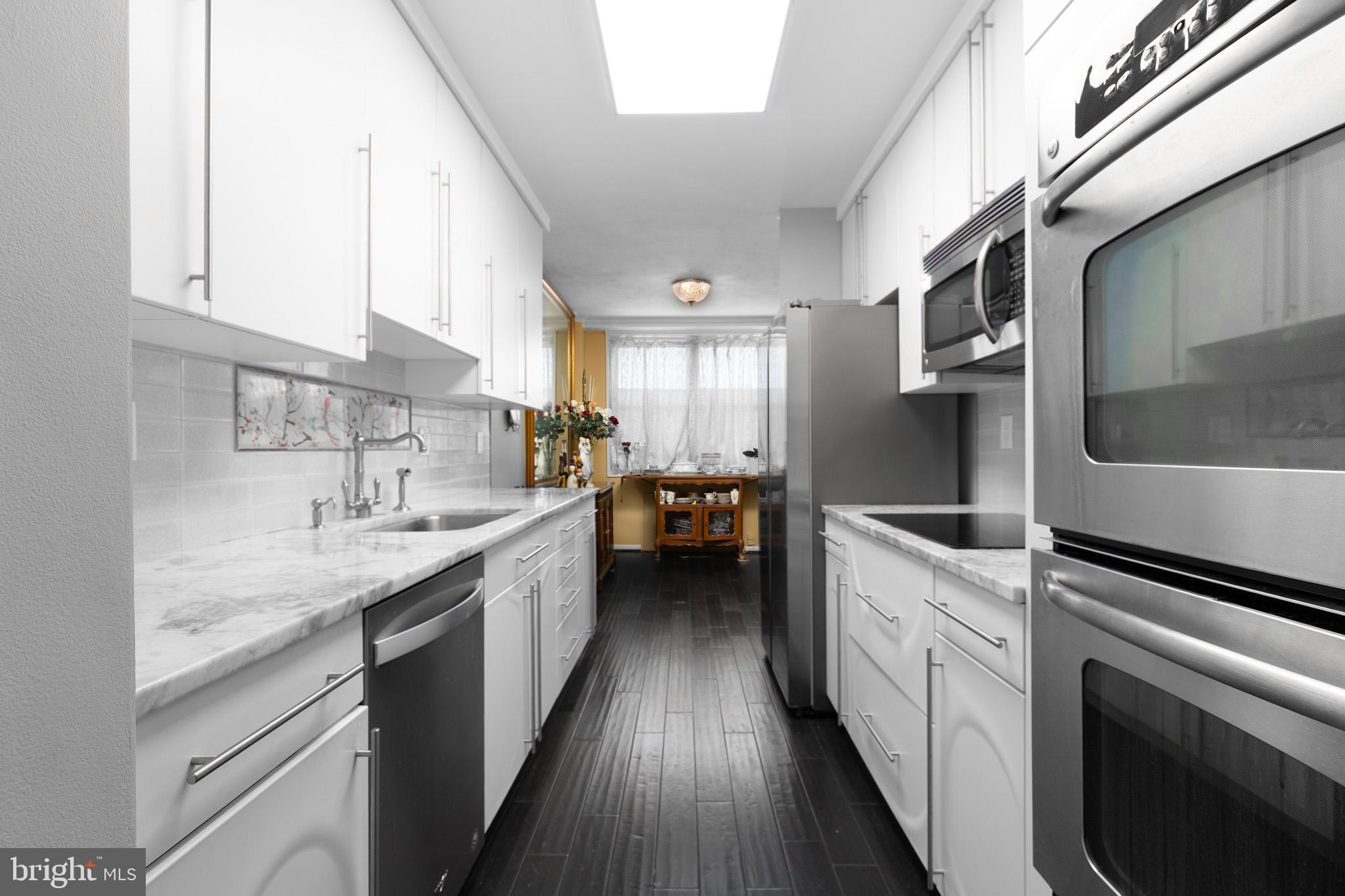 20 Conshohocken State Road, Unit 611 Bala Cynwyd, PA 19004 - Photo 5 of 25 a kitchen with a sink cabinets and appliances