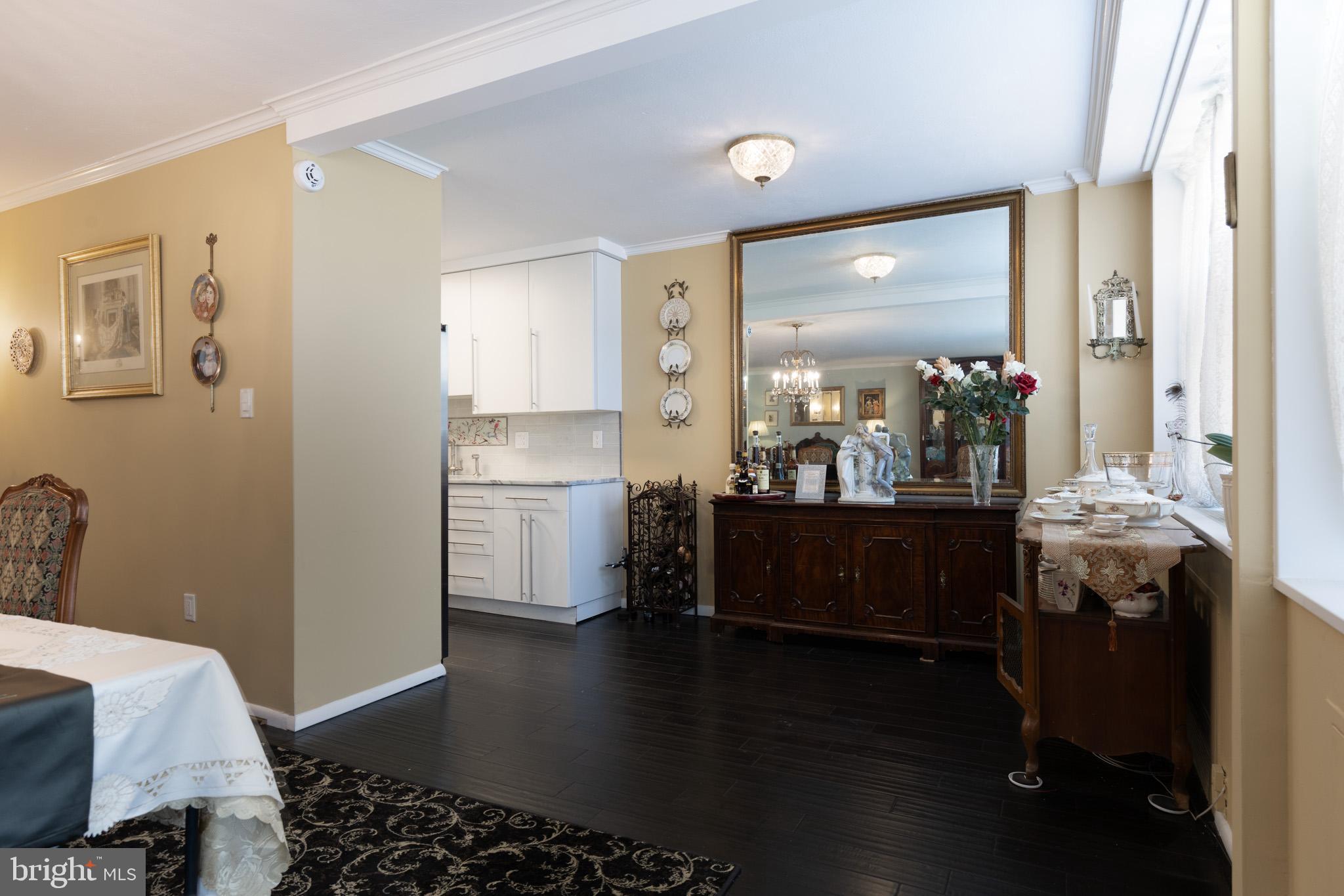 20 Conshohocken State Road, Unit 611 Bala Cynwyd, PA 19004 - Photo 8 of 25 a room with lots of wooden furniture and a window