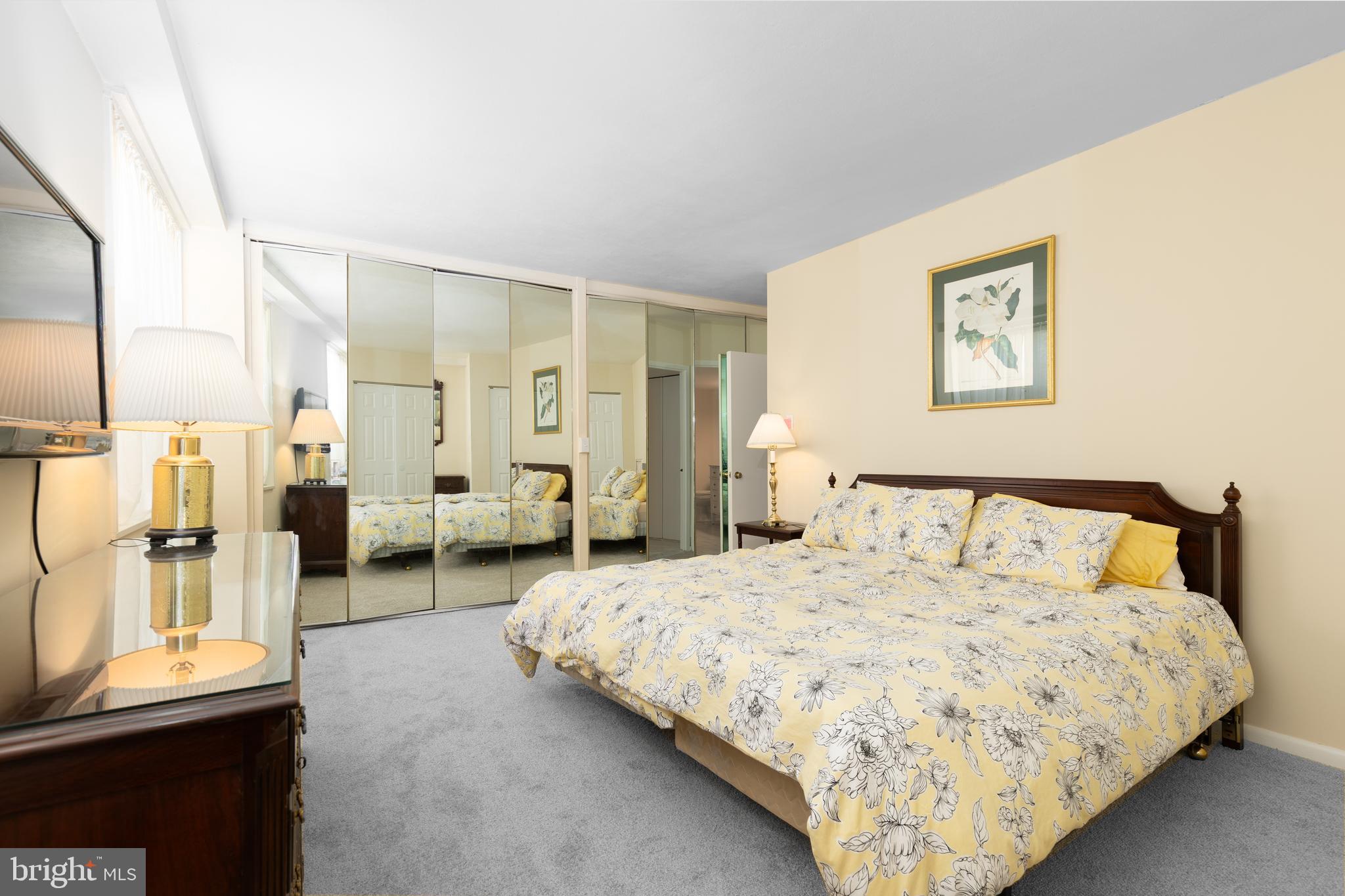 20 Conshohocken State Road, Unit 611 Bala Cynwyd, PA 19004 - Photo 9 of 25 a spacious bedroom with a bed and glass door