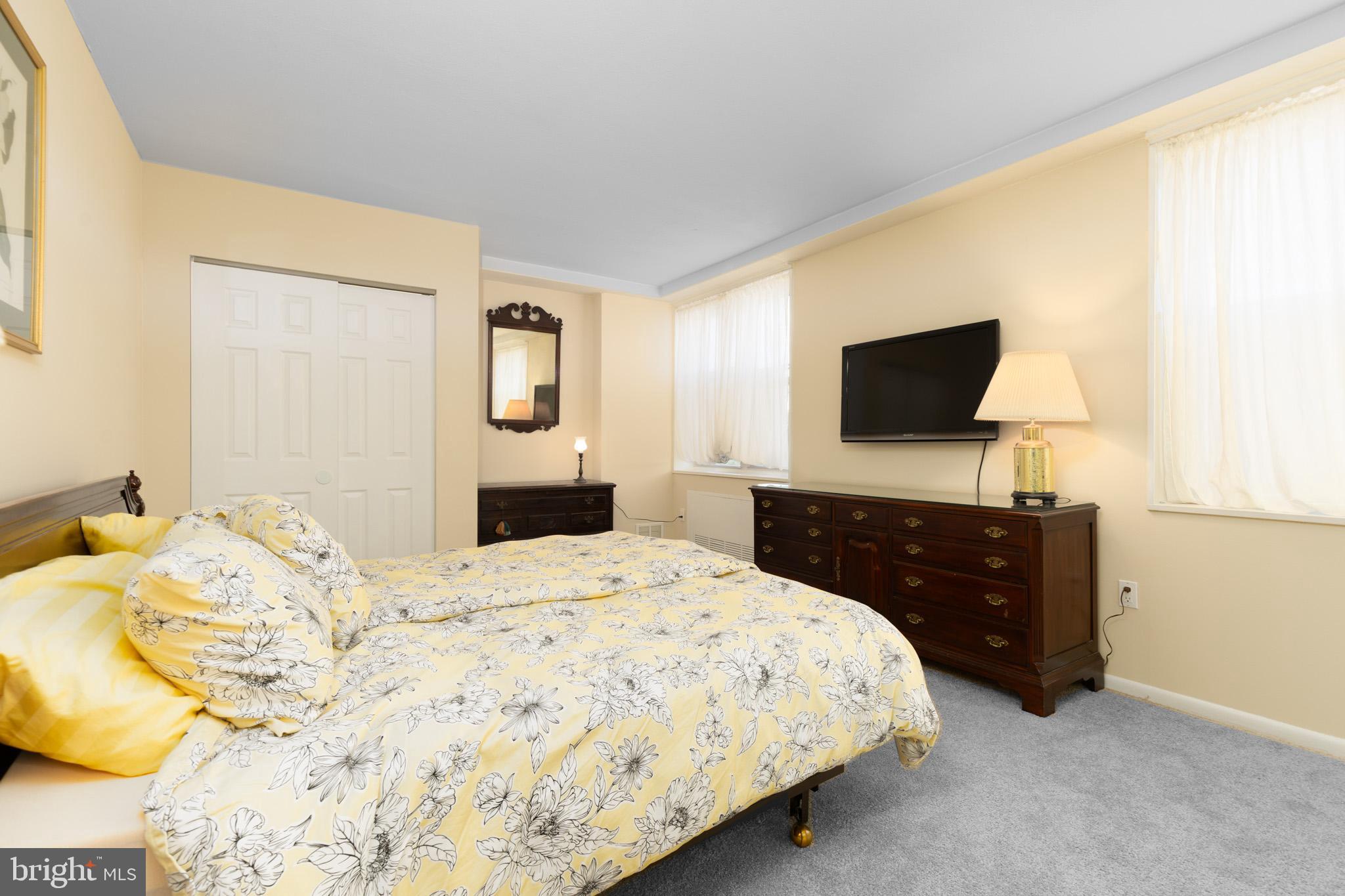 20 Conshohocken State Road, Unit 611 Bala Cynwyd, PA 19004 - Photo 10 of 25 a bedroom with a bed and a flat screen tv