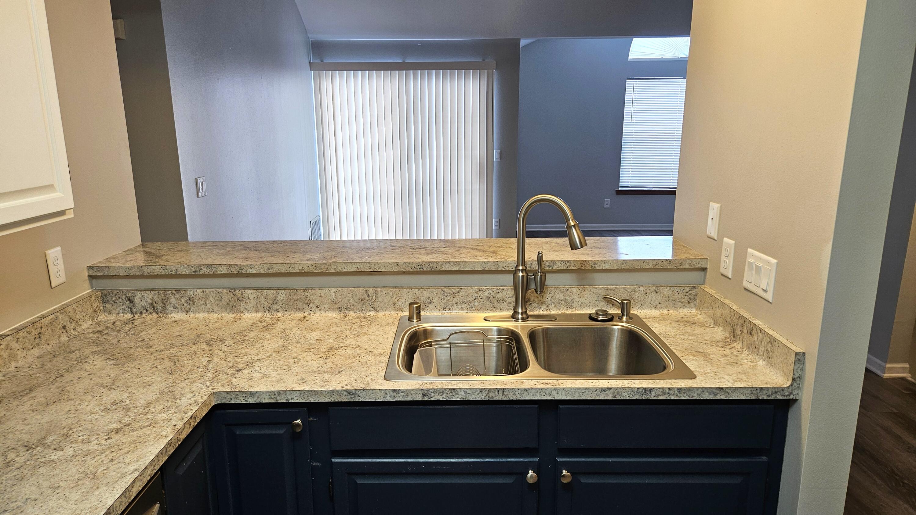 4887 Easy Street, Unit 11 Delafield, WI 53029 - Photo 6 of 26 Kitchen towards Living Room with Patio doors to private balcony.