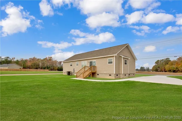 a big house with swimming pool in front of it