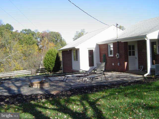 24335 Evergreen Mills Road Aldie, VA 20105 - Photo 4 of 5 a view of house with backyard and trees