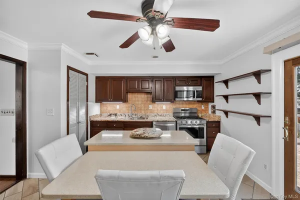 a dining room with furniture and window