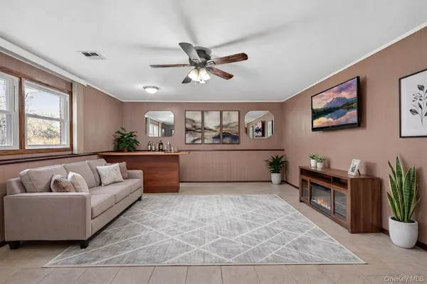 a living room with furniture and windows