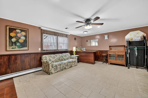 a living room with furniture and a window