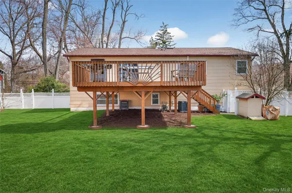 a view of a house with a yard porch and sitting area
