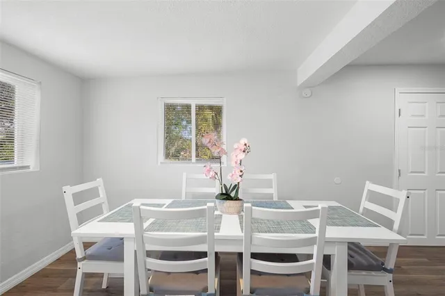 a view of a dining room with furniture and window