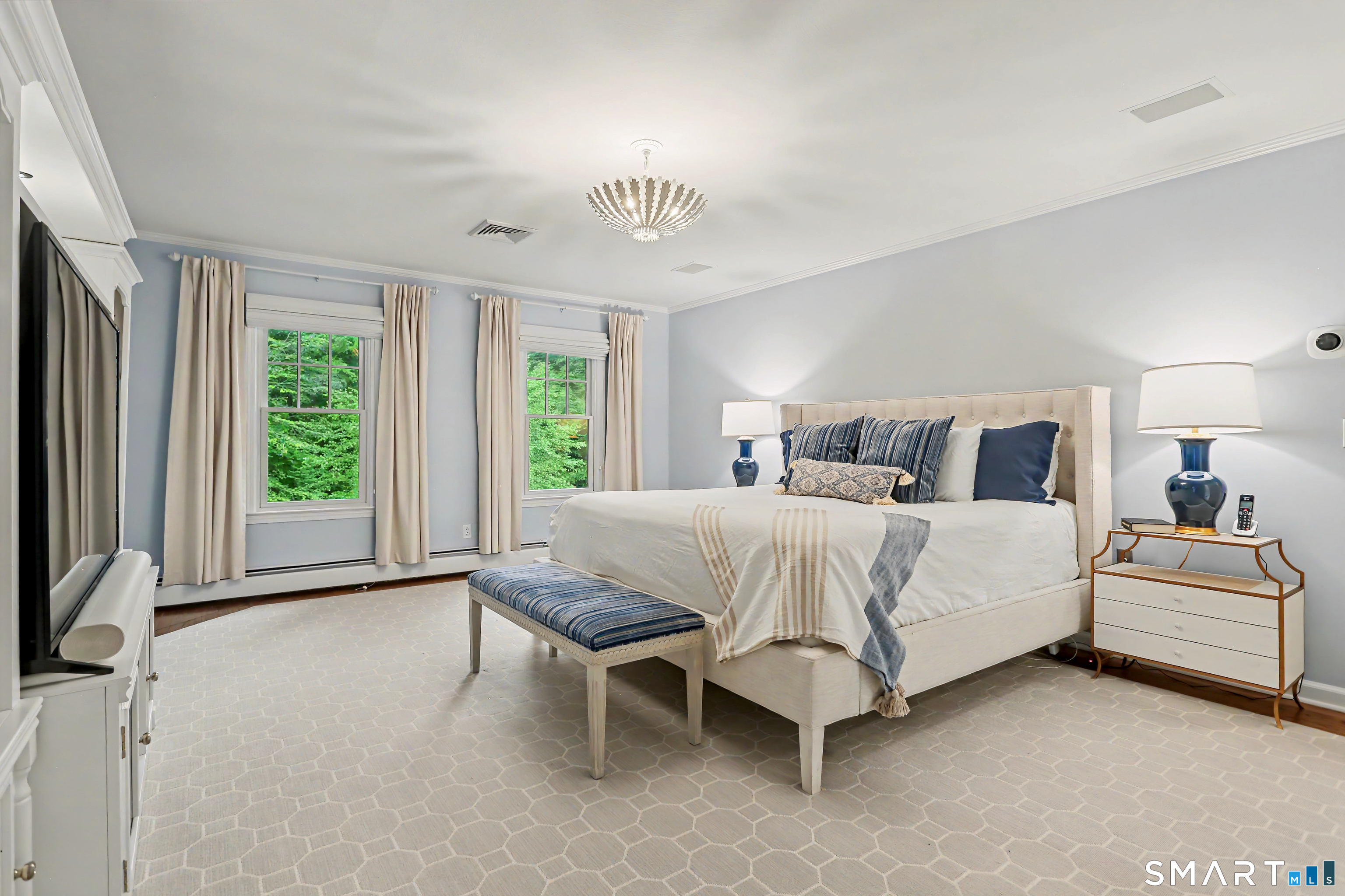 108 Logan Road New Canaan, CT 06840 - Photo 19 of 40 a bedroom with a bed and a large window