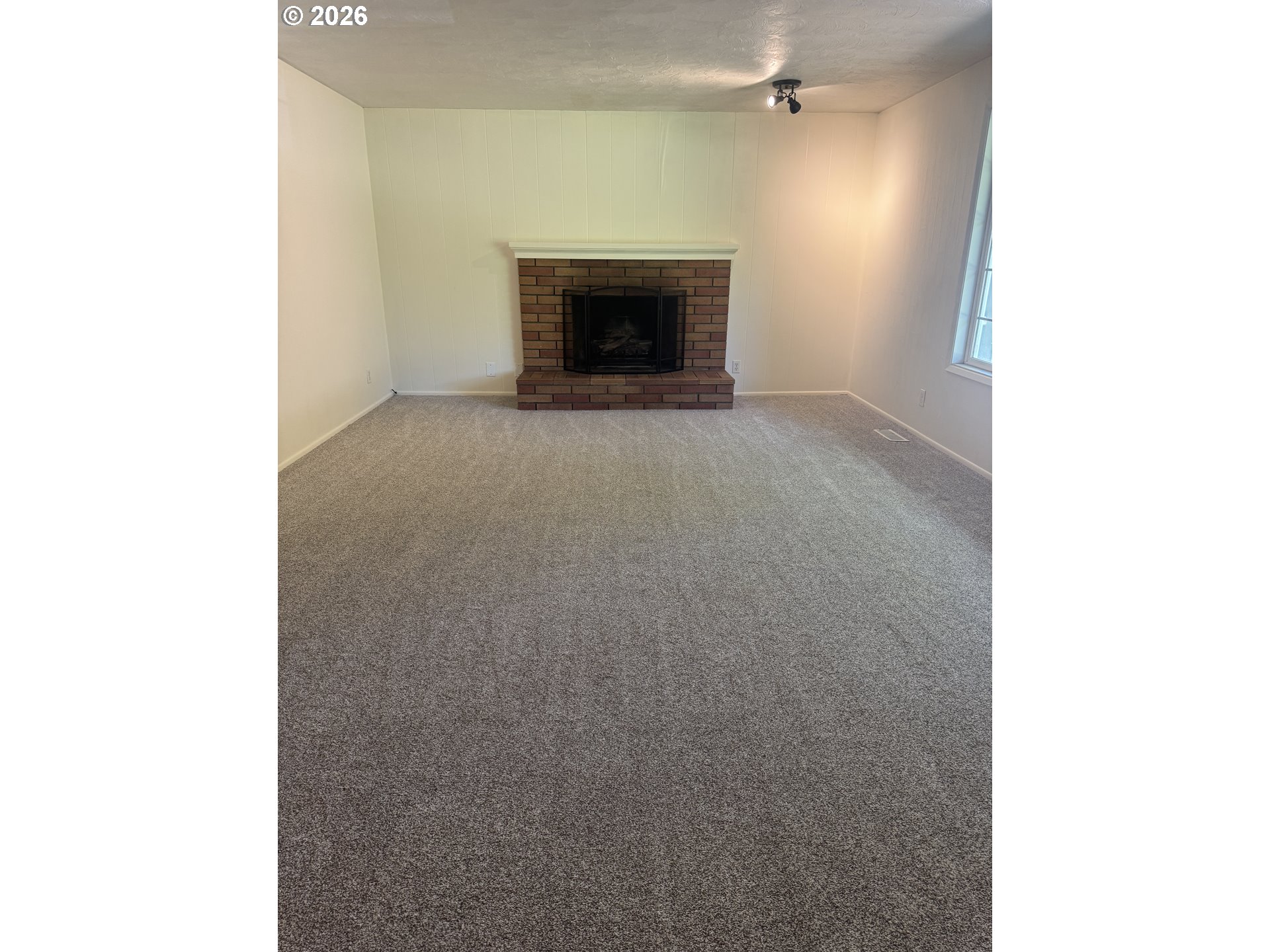 260 Susan Street Eugene, OR 97404 - Photo 6 of 33 a view of an empty room with a fireplace
