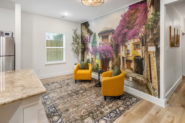 a living room with furniture and a window