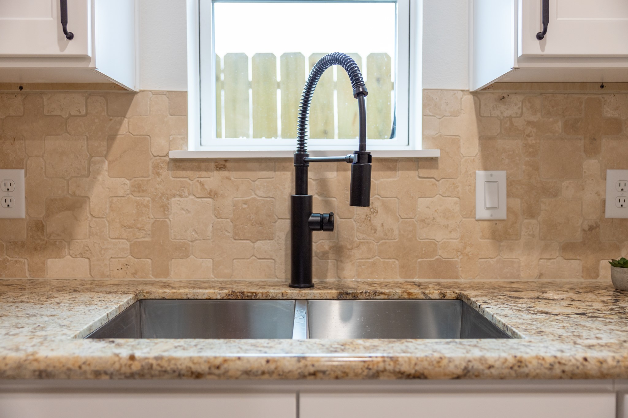 5015 Reed Road Houston, TX 77033 - Photo 8 of 13 a view of a faucet a sink and a window