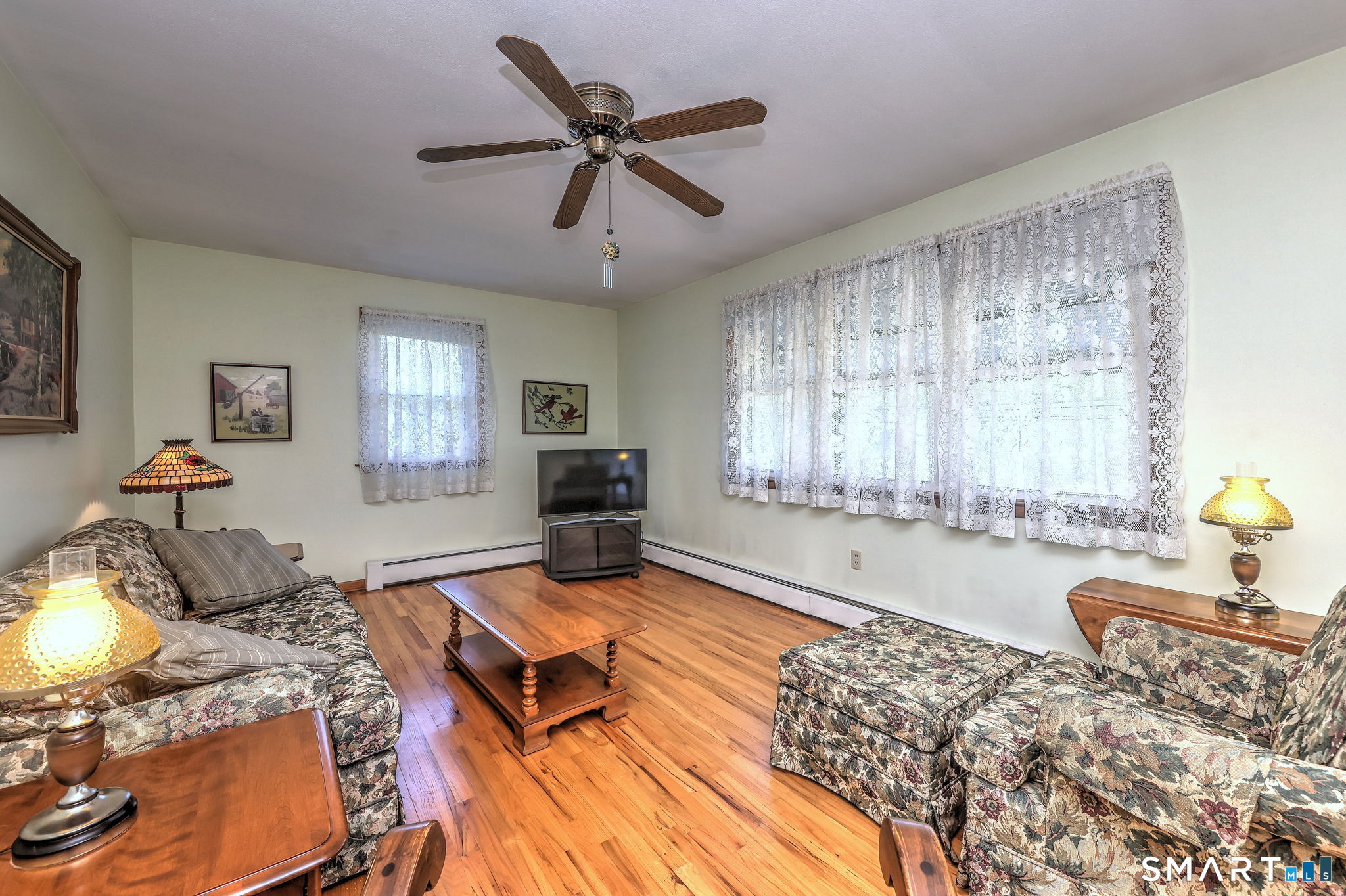 212 Swain Avenue Meriden, CT 06450 - Photo 15 of 38 a living room with furniture and a large window