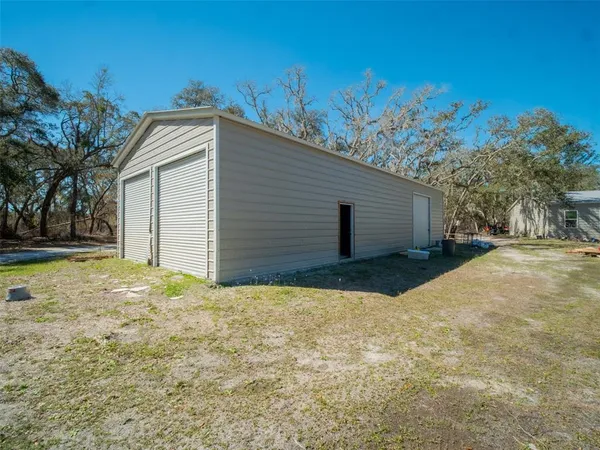 a view of garage and yard