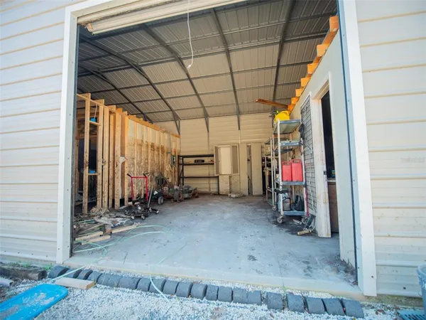 a view of a garage with chairs