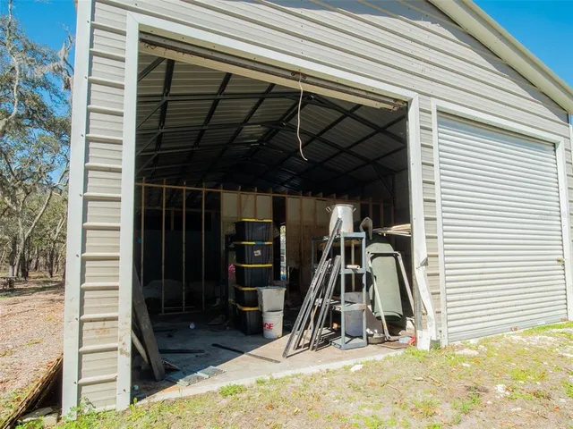 a view of a garage with rack and stairs