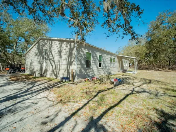 a view of house with yard