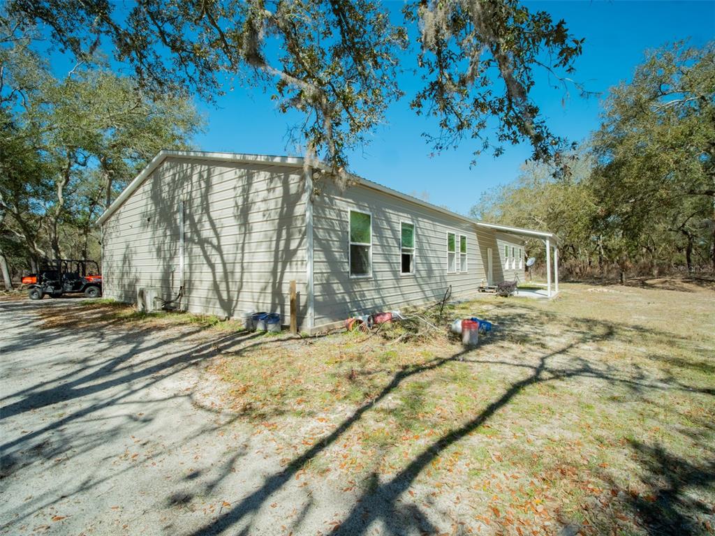 3949 184th Street Wellborn, FL 32094 - Photo 4 of 35 a view of house with yard