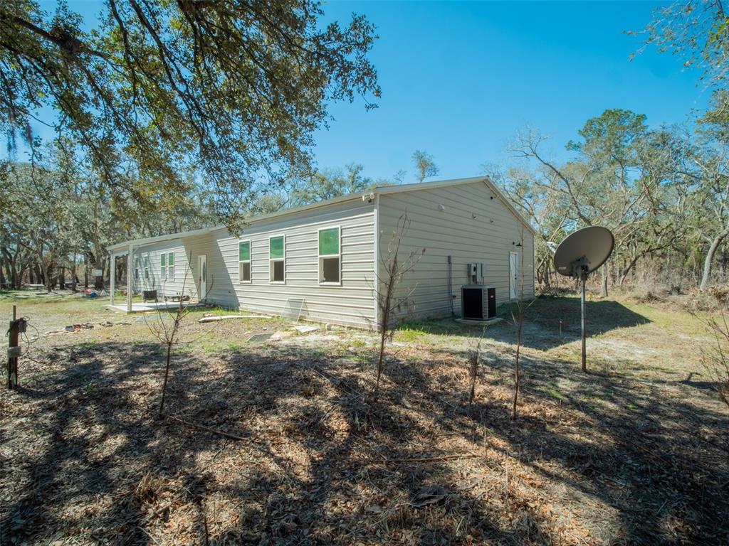3949 184th Street Wellborn, FL 32094 - Photo 5 of 35 a house view with a backyard space
