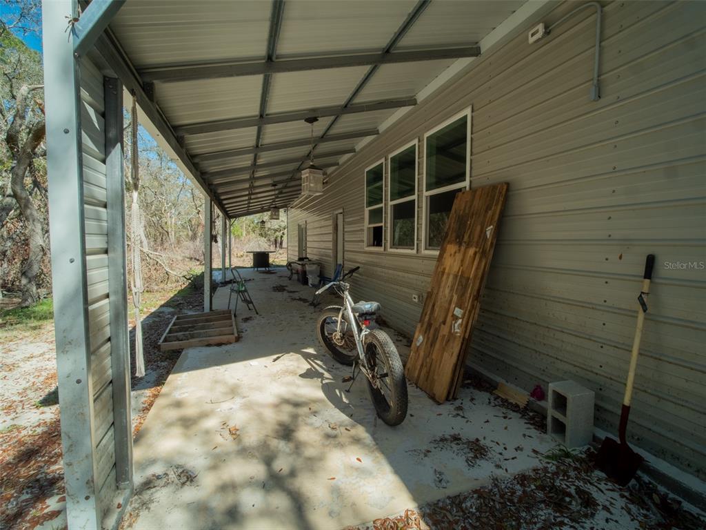 3949 184th Street Wellborn, FL 32094 - Photo 8 of 35 a view of a porch with furniture