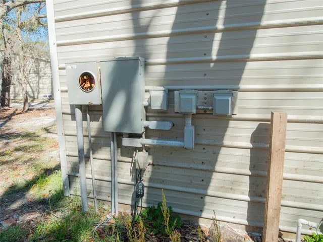 a front view of a house with plants