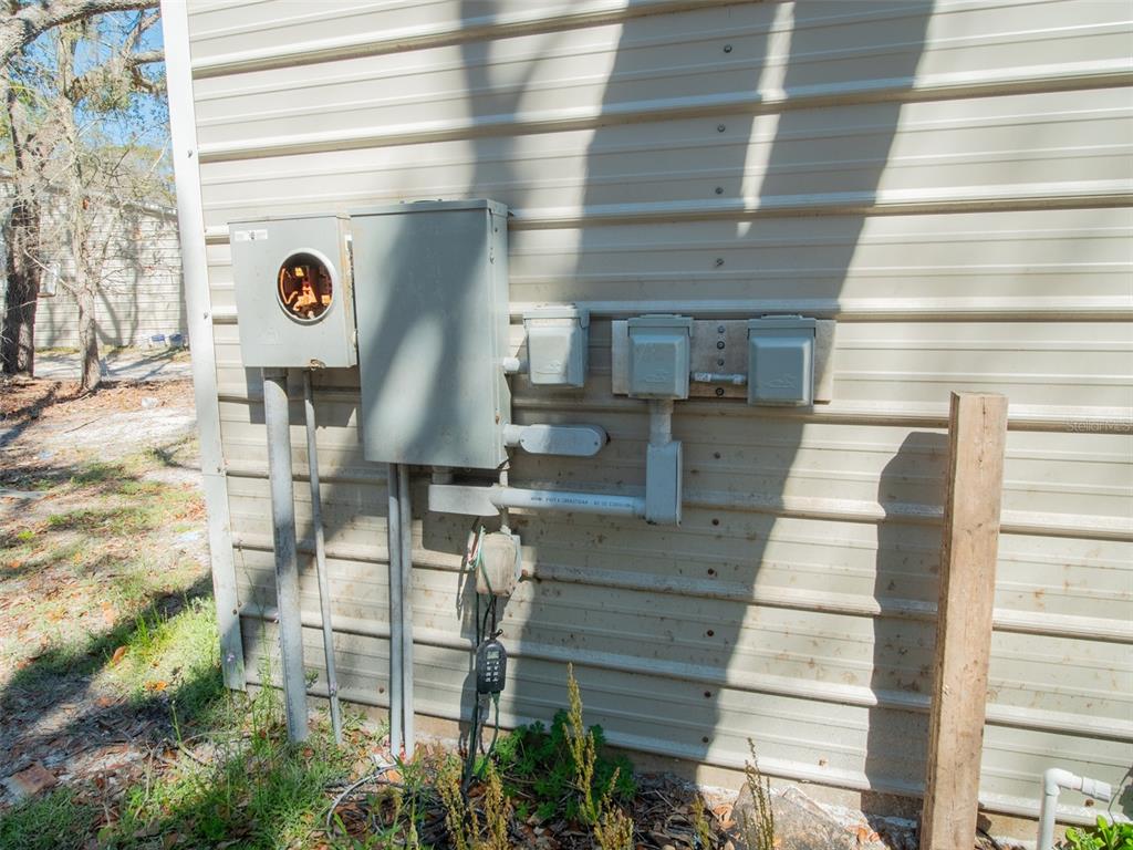 3949 184th Street Wellborn, FL 32094 - Photo 9 of 35 a front view of a house with plants
