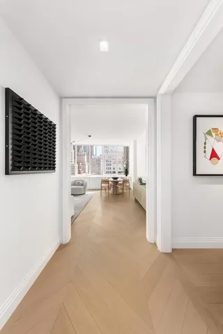 a view of a livingroom with furniture and white walls