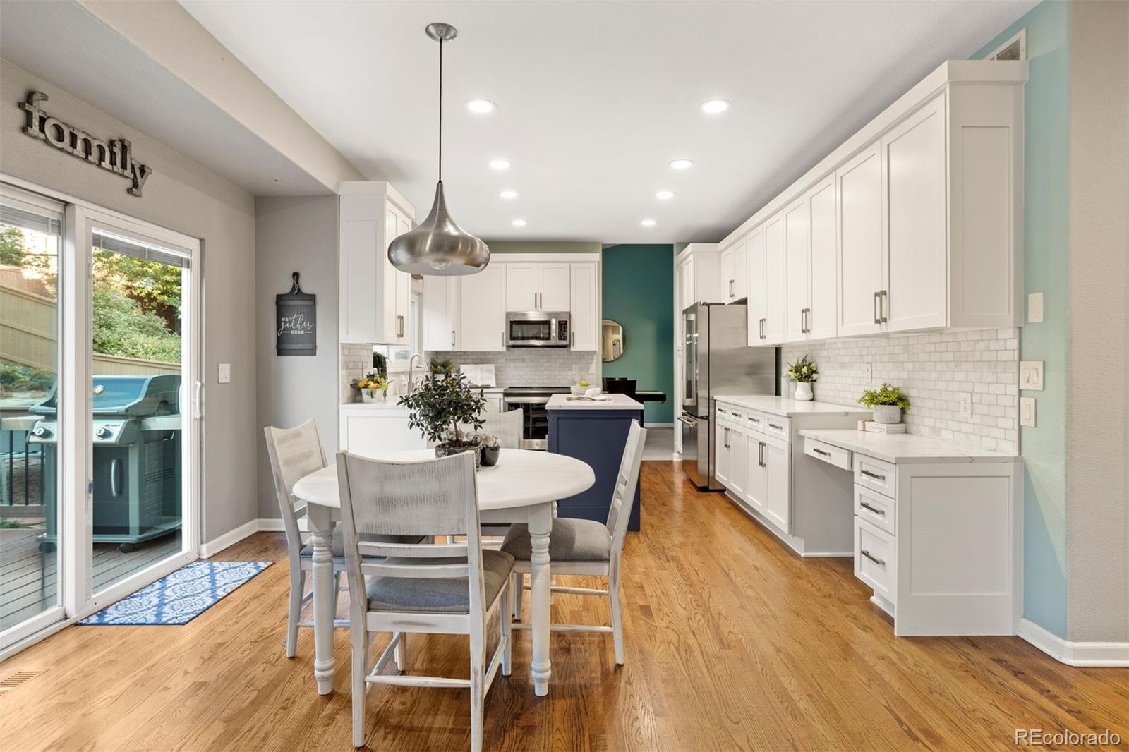 5426 East Knoll Place Highlands Ranch, CO 80130 - Photo 12 of 28 a view of kitchen with cabinets table and chairs