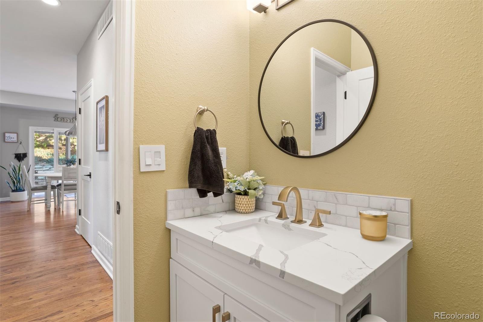 5426 East Knoll Place Highlands Ranch, CO 80130 - Photo 16 of 28 a bathroom with a sink and a mirror