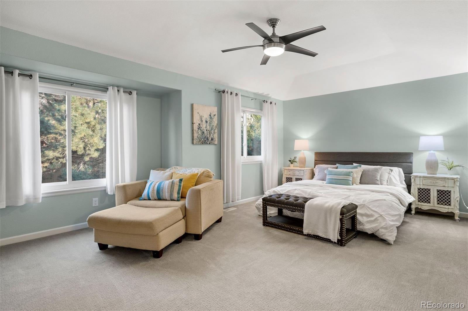 5426 East Knoll Place Highlands Ranch, CO 80130 - Photo 17 of 28 a spacious bedroom with a bed and window