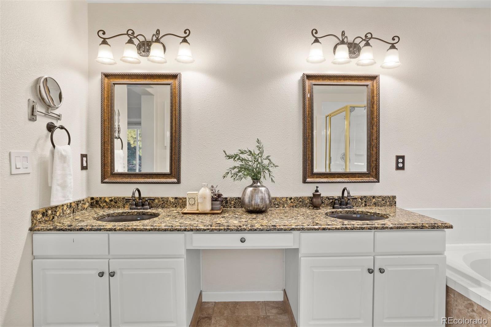5426 East Knoll Place Highlands Ranch, CO 80130 - Photo 19 of 28 a bathroom with sink and mirror