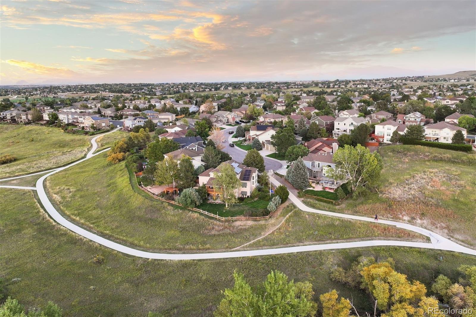5426 East Knoll Place Highlands Ranch, CO 80130 - Photo 2 of 28 a view of a swimming pool