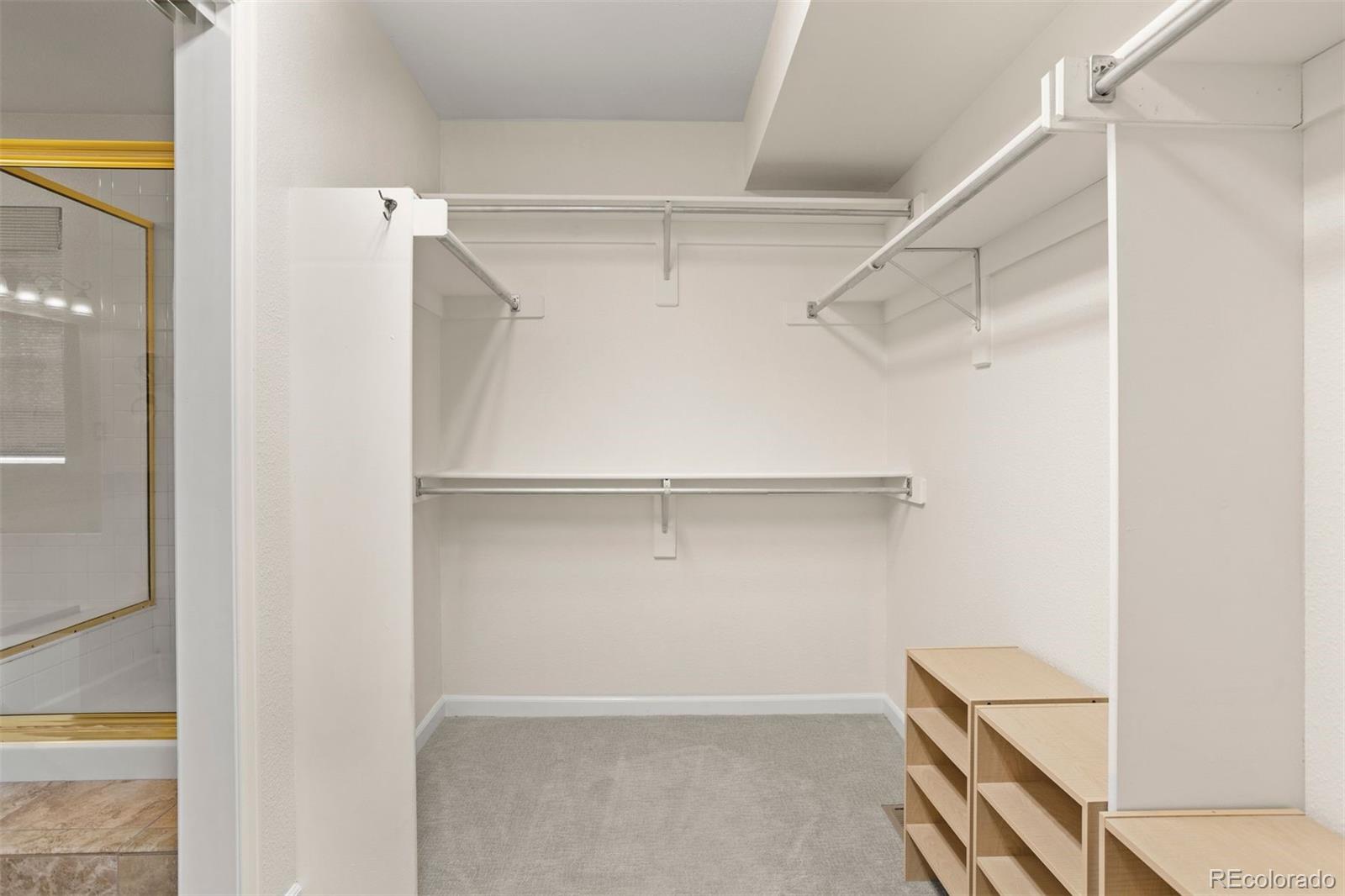 5426 East Knoll Place Highlands Ranch, CO 80130 - Photo 21 of 28 a view of an empty walk in closet