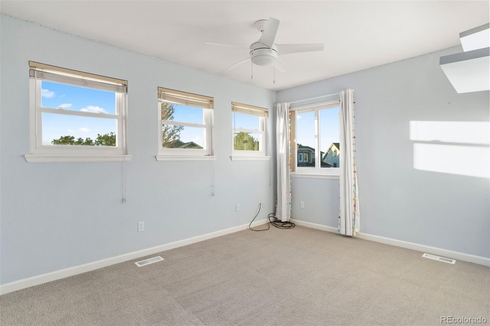 5426 East Knoll Place Highlands Ranch, CO 80130 - Photo 22 of 28 a view of an empty room with a window