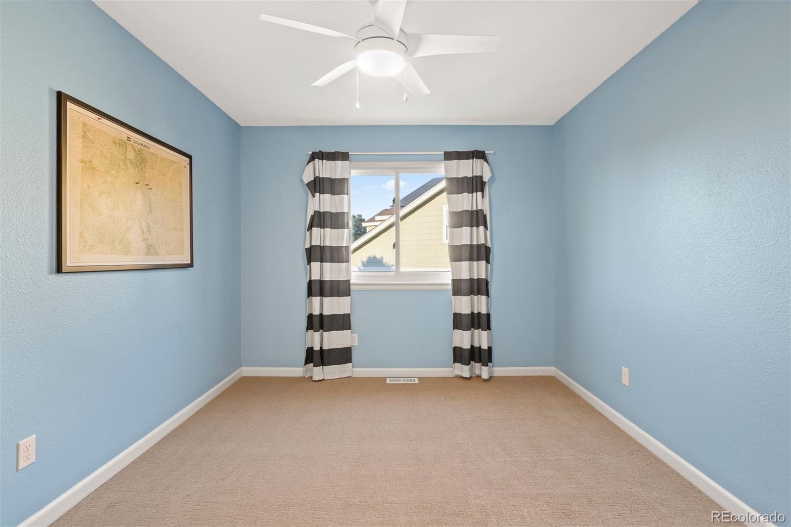 5426 East Knoll Place Highlands Ranch, CO 80130 - Photo 23 of 28 an empty room with windows and closet